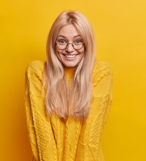 cute-cheerful-blonde-young-woman-raises-shoulders-2022-02-04-02-06-55-utc.jpg